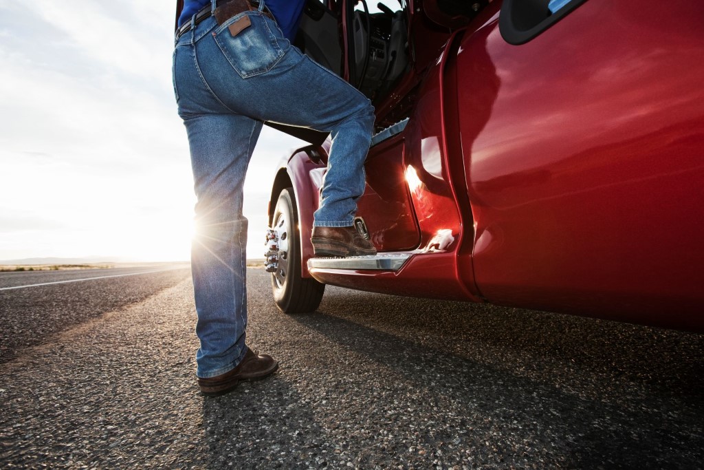 Find Your Path | Driving at Sunset - Driver Stepping into the Cab of a Commercial Truck at Sunset